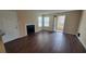 Living room with fireplace and access to patio at 5600 Devonbriar Way # N202, Orlando, FL 32822
