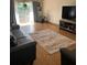 Bright living room with gray couches and large area rug at 458 Windmeadows St, Altamonte Springs, FL 32701