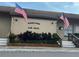 Community clubhouse with American flags at 458 Windmeadows St, Altamonte Springs, FL 32701