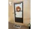 Inviting condo entry with decorative wreath and welcoming mat at 458 Windmeadows St, Altamonte Springs, FL 32701