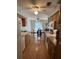 Open kitchen with views to dining area and wood flooring at 458 Windmeadows St, Altamonte Springs, FL 32701