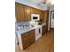 Well-equipped kitchen with wood cabinets and light countertops at 458 Windmeadows St, Altamonte Springs, FL 32701