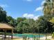 Community pool with a fenced area at 458 Windmeadows St, Altamonte Springs, FL 32701
