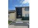 Condo building exterior with stairs and landscaping at 458 Windmeadows St, Altamonte Springs, FL 32701