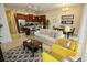 Open concept living room with a kitchen island, modern appliances, and seating area at 314 Captiva Dr, Davenport, FL 33896