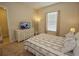 Spacious bedroom with a dresser and a window at 314 Captiva Dr, Davenport, FL 33896