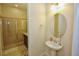 Clean bathroom with pedestal sink and shower at 314 Captiva Dr, Davenport, FL 33896