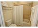 Clean bathroom with tub, shower, and white curtain at 314 Captiva Dr, Davenport, FL 33896