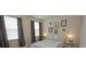 Bedroom with a double bed and gray curtains at 314 Captiva Dr, Davenport, FL 33896