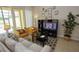 Cozy living room with comfortable seating and a large TV at 314 Captiva Dr, Davenport, FL 33896