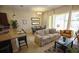 Spacious living area with a neutral color palette and access to a patio at 314 Captiva Dr, Davenport, FL 33896