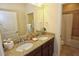 Double vanity bathroom with granite countertop and a shower at 314 Captiva Dr, Davenport, FL 33896