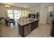Modern kitchen with granite island, stainless steel appliances, and breakfast bar at 314 Captiva Dr, Davenport, FL 33896