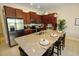 Modern kitchen featuring granite countertops, stainless steel appliances, and an island at 314 Captiva Dr, Davenport, FL 33896