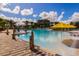 Resort-style pool with yellow umbrellas and a shallow water area at 314 Captiva Dr, Davenport, FL 33896