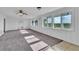 Spacious living room featuring grey carpet and large windows at 1322 Susannah Blvd, Orlando, FL 32803