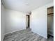 Spacious bedroom with wood-look flooring and a large closet at 653 W Thomas St, Lakeland, FL 33805