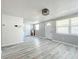 Open living space with light gray walls and wood-look floors at 653 W Thomas St, Lakeland, FL 33805