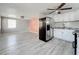 Modern kitchen with white cabinets and stainless steel appliances at 653 W Thomas St, Lakeland, FL 33805