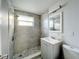 Updated bathroom with gray tile shower and vanity at 653 W Thomas St, Lakeland, FL 33805