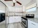 Well-equipped kitchen with stainless steel appliances and white cabinetry at 653 W Thomas St, Lakeland, FL 33805