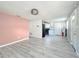 Open living room with light flooring and a view into the kitchen at 653 W Thomas St, Lakeland, FL 33805