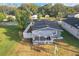 Aerial view of a charming gray house with a yard at 653 W Thomas St, Lakeland, FL 33805