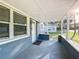 Inviting front porch with white door and gray exterior at 653 W Thomas St, Lakeland, FL 33805