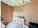 Unfinished basement area with a workbench and storage at 653 W Thomas St, Lakeland, FL 33805