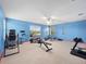 Large home gym with a variety of equipment, including weights and cardio machines at 7351 Spring Mountain Ln, Yalaha, FL 34797