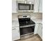 Stainless steel range with built-in microwave above at 511 W Gardenia Dr, Orange City, FL 32763