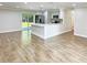 Remodeled kitchen features stainless steel appliances and an island at 511 W Gardenia Dr, Orange City, FL 32763