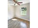 Spacious bedroom with tile flooring and large window at 511 W Gardenia Dr, Orange City, FL 32763