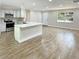 Open concept kitchen boasts stainless steel appliances and an island at 511 W Gardenia Dr, Orange City, FL 32763