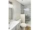 Updated bathroom with gray marble tile shower at 511 W Gardenia Dr, Orange City, FL 32763