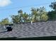 House features a dark gray asphalt shingle roof at 511 W Gardenia Dr, Orange City, FL 32763
