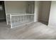 Upper level landing with carpeted floor and staircase at 8282 Tavistock Lakes Blvd, Orlando, FL 32827