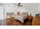 Spacious bedroom featuring wood floors and a large TV at 1401 Avalon Blvd, Casselberry, FL 32707