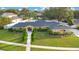 Aerial view of a single-Gathering home with a pool and lush landscaping at 2506 Emerald Tree Ln, Apopka, FL 32712