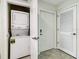 Stackable washer and dryer in a small laundry closet at 3161 Paradox Cir # 101, Kissimmee, FL 34746