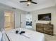 Spacious bedroom with a large TV and en-suite bathroom at 3161 Paradox Cir # 101, Kissimmee, FL 34746