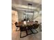 Dining room with a live-edge wood table and brown leather chairs at 3161 Paradox Cir # 101, Kissimmee, FL 34746
