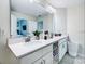 Double vanity bathroom with white cabinets and a large mirror at 3161 Paradox Cir # 101, Kissimmee, FL 34746