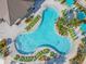 Community pool with surrounding lounge chairs at 3161 Paradox Cir # 101, Kissimmee, FL 34746