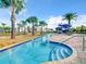 Relaxing lazy river with poolside lounge chairs at 3161 Paradox Cir # 101, Kissimmee, FL 34746