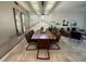 Spacious dining area with live-edge wood table and modern lighting at 3161 Paradox Cir # 101, Kissimmee, FL 34746