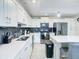 Spacious kitchen with an island, stainless steel appliances, and white cabinets at 3161 Paradox Cir # 101, Kissimmee, FL 34746