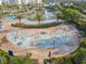 Community water park with a splash pad and lounge area at 3161 Paradox Cir # 101, Kissimmee, FL 34746