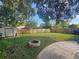 Large backyard with a fire pit, shed, and patio area at 3041 Peel Ave, Orlando, FL 32806