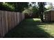 Long, narrow backyard with wooden fence at 3041 Peel Ave, Orlando, FL 32806